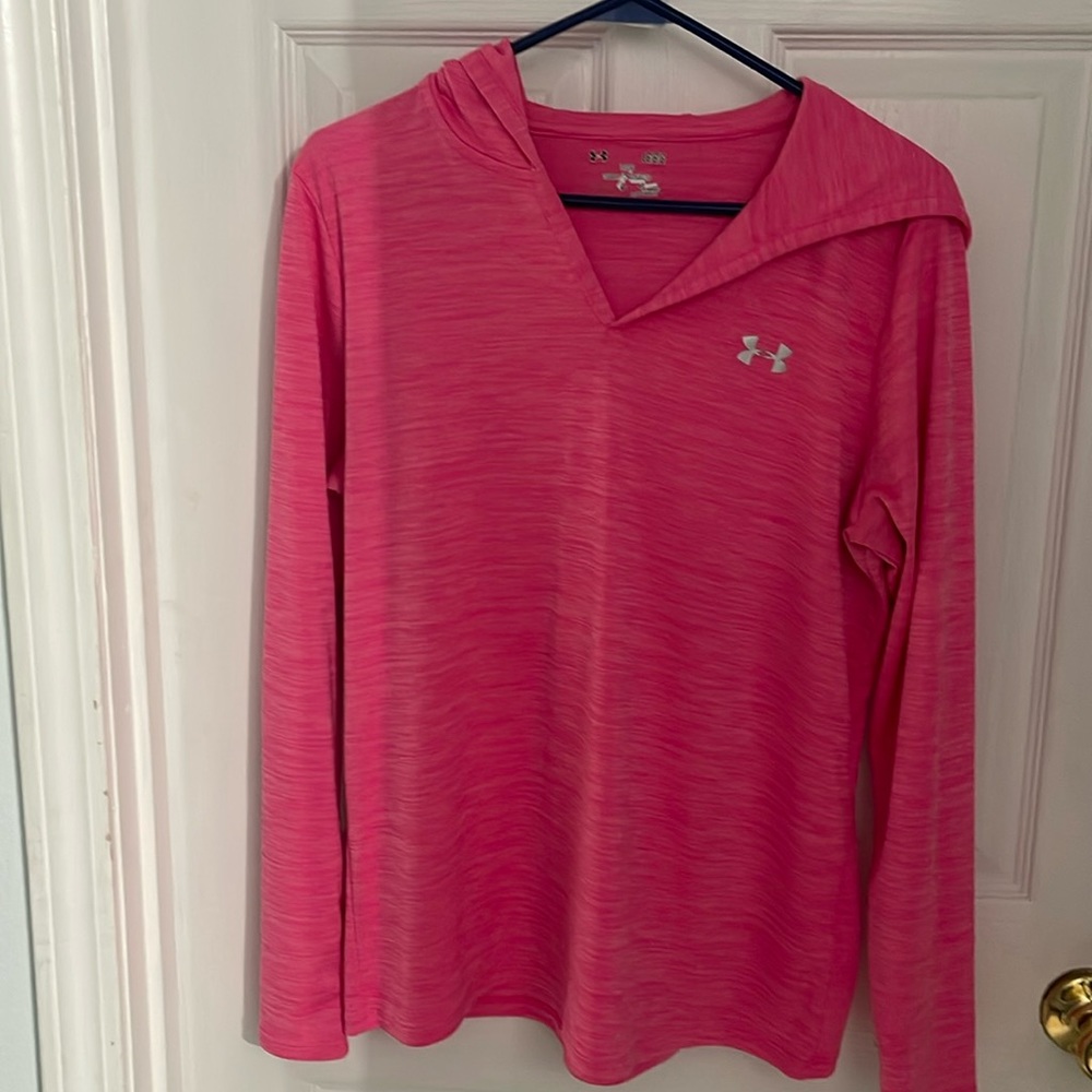 Under Armour, loose hooded top in pink.
